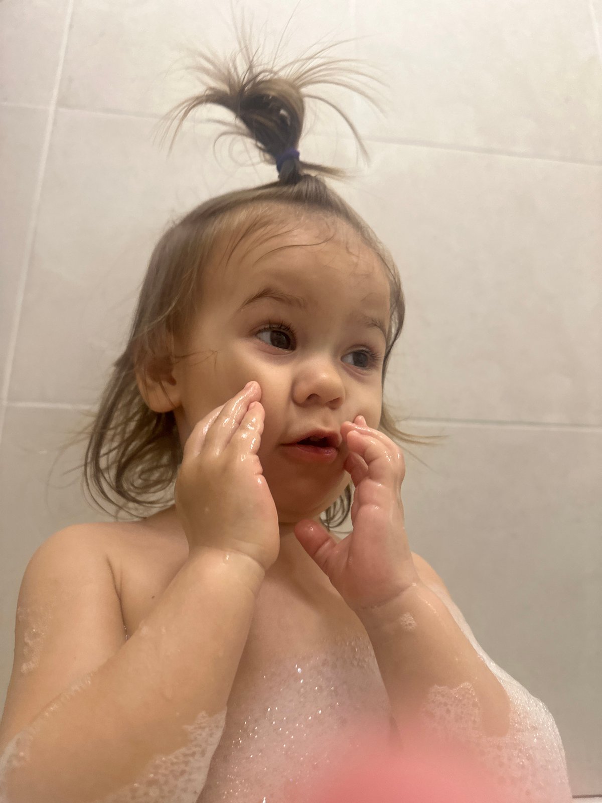 Child enjoys bubble bath in Kharnavy home