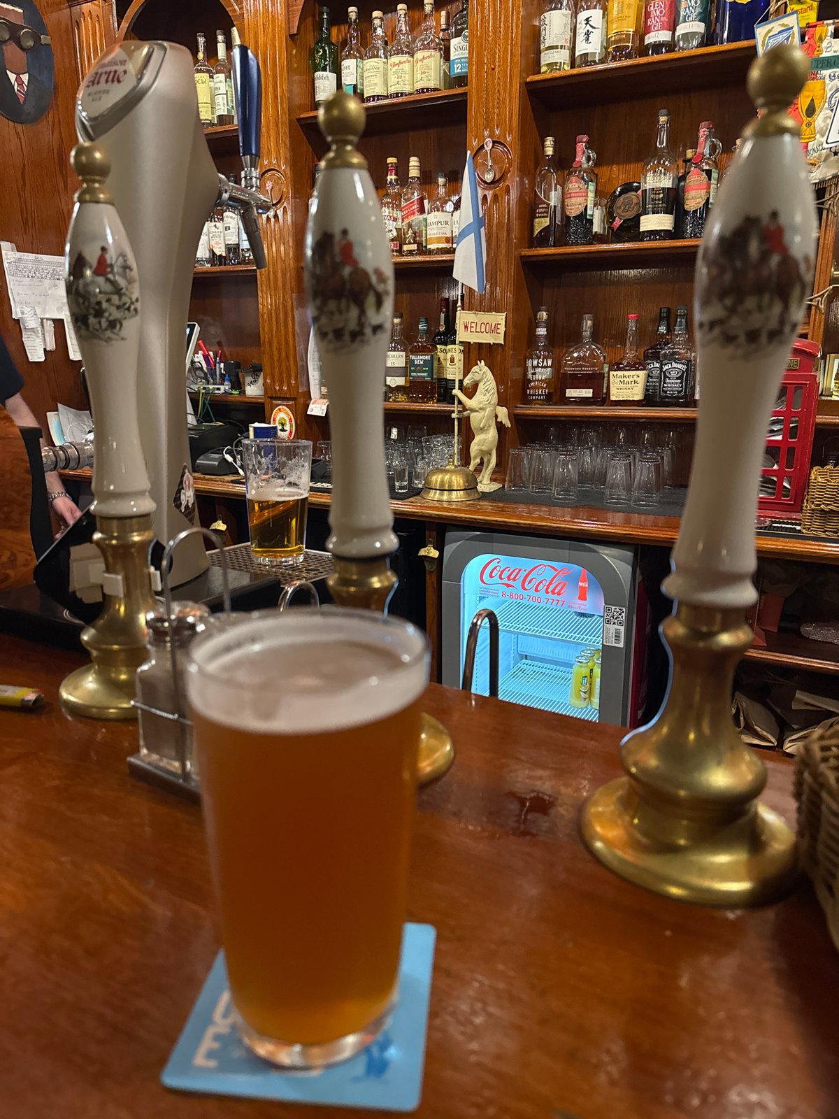 Inside a Saint Petersburg bar, taps poured and shelves stacked