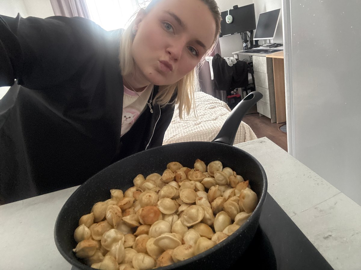 Woman documents cooking pelmeni and relaxing at home in Russia