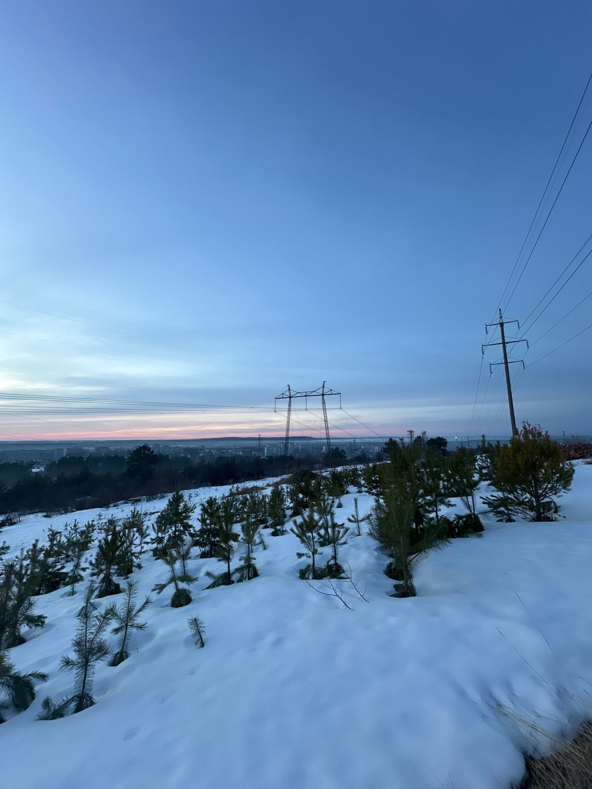 Winter scenes documented in Chaikovsky, Russia during dusk hours