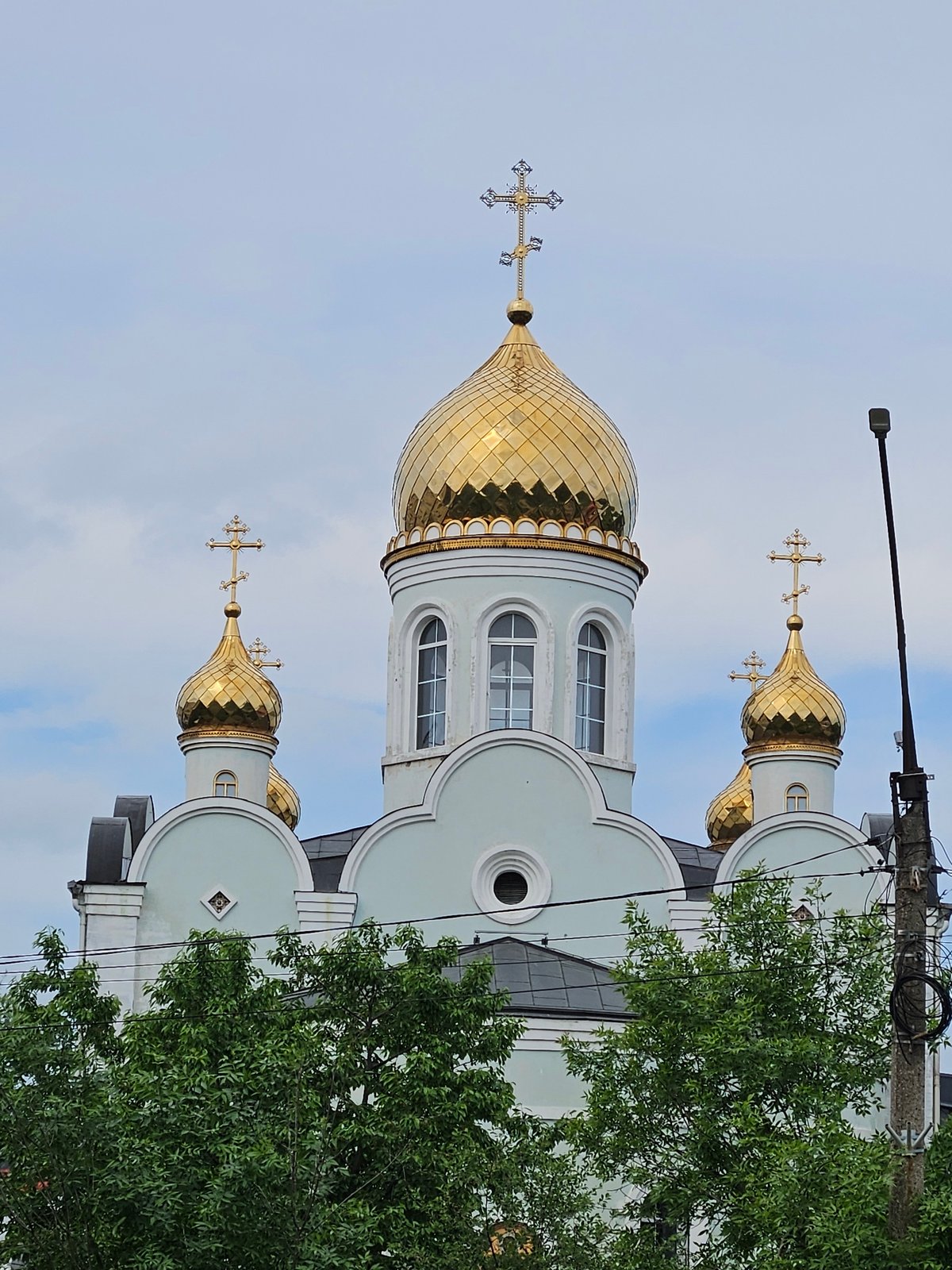 Orthodox church with golden domes observed in Rodniki, Russia