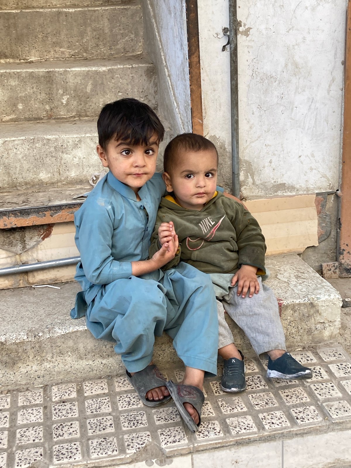 Children play on concrete structures in Quetta