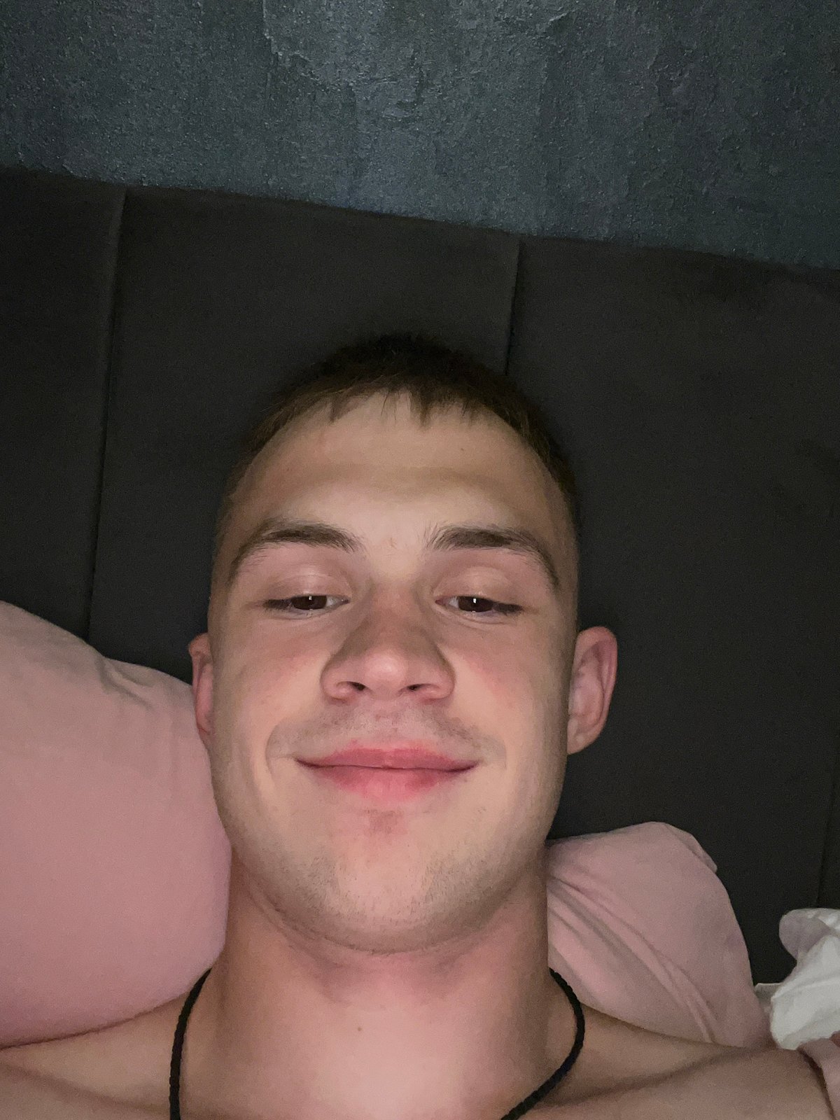 Casual bedroom selfie series on pink pillows