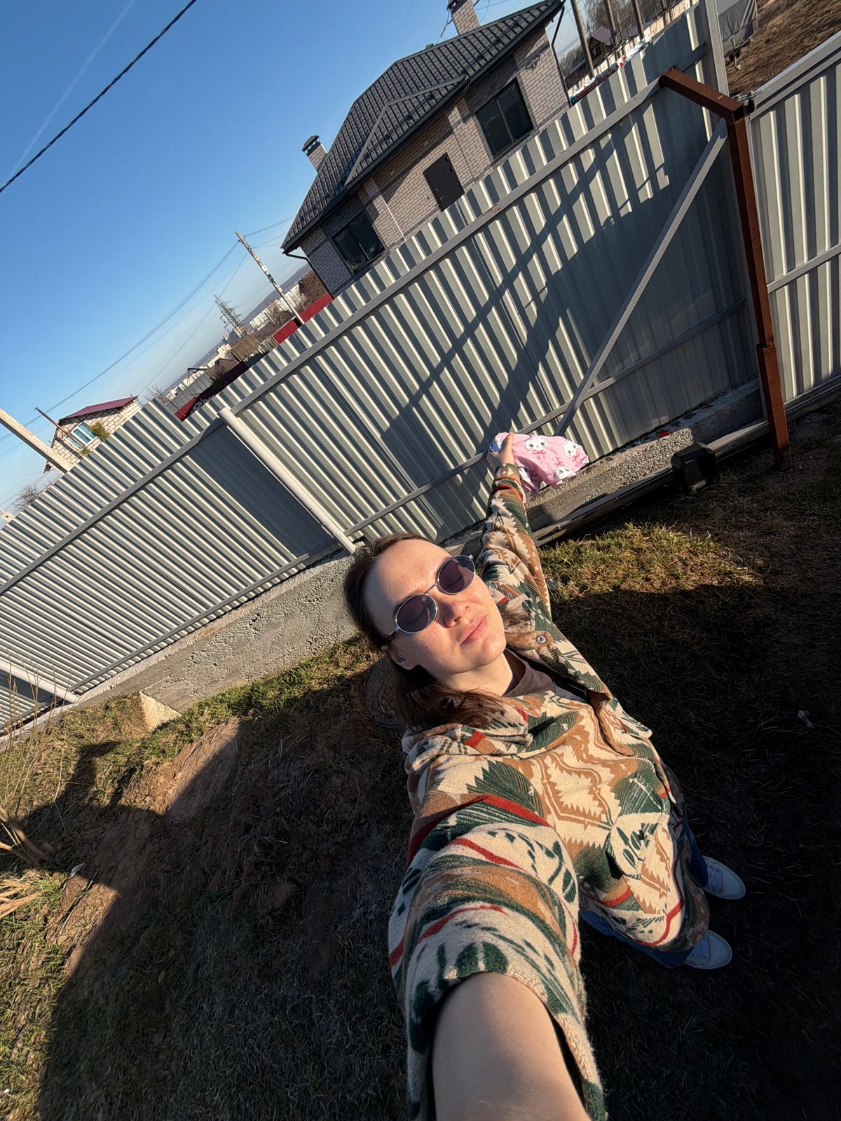 Person takes ground selfie in Chaikovsky under clear skies