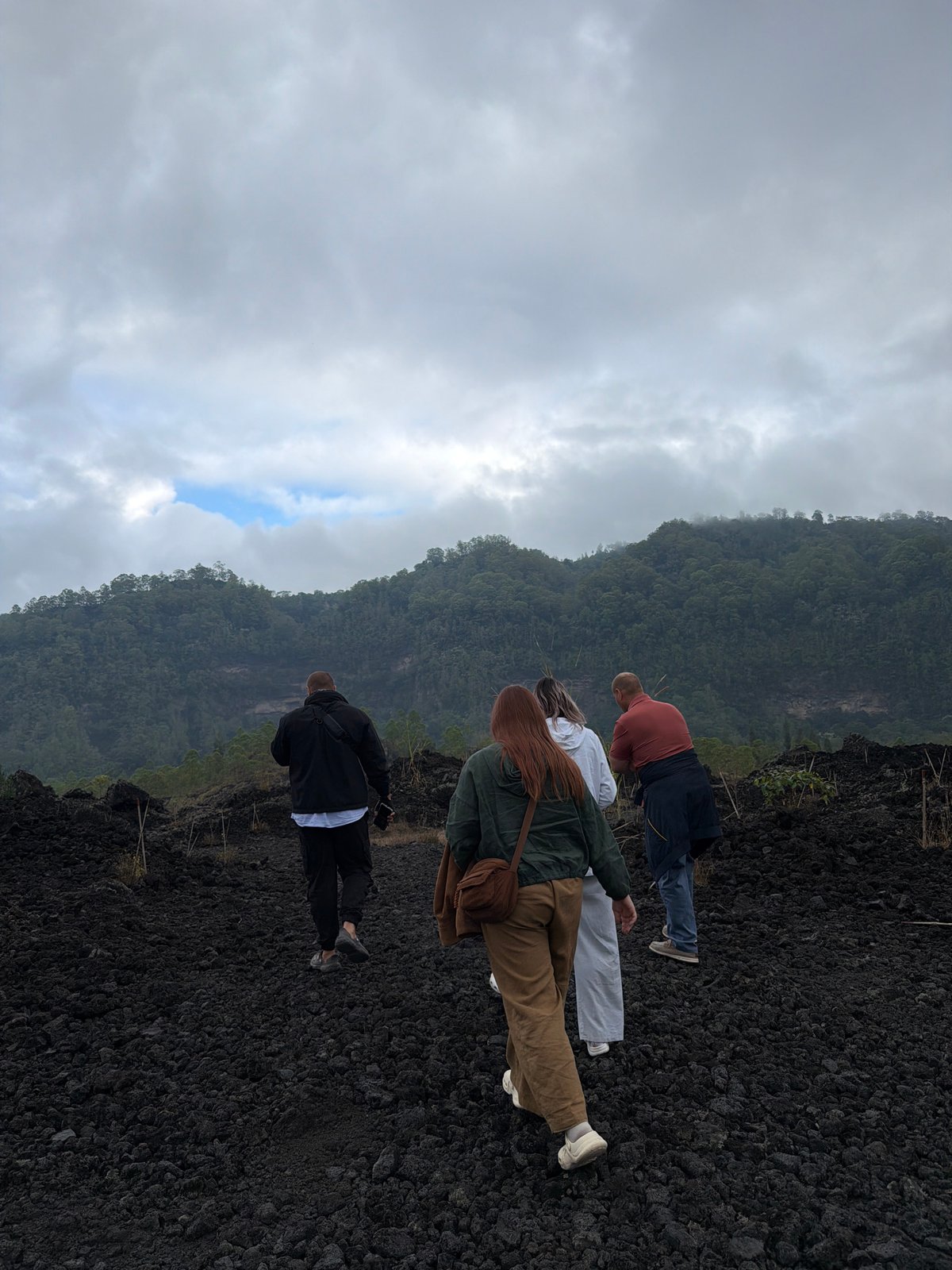 Exploring Kintamani's volcanic lava fields on a cloudy morning