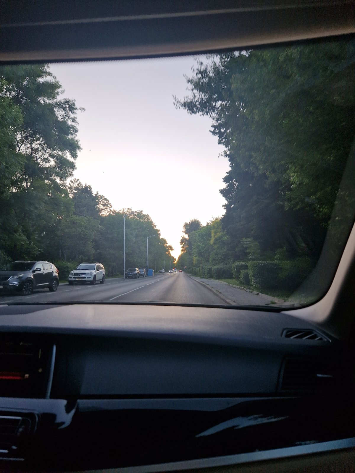 Afternoon drive through Sofia streets, city views from inside a car