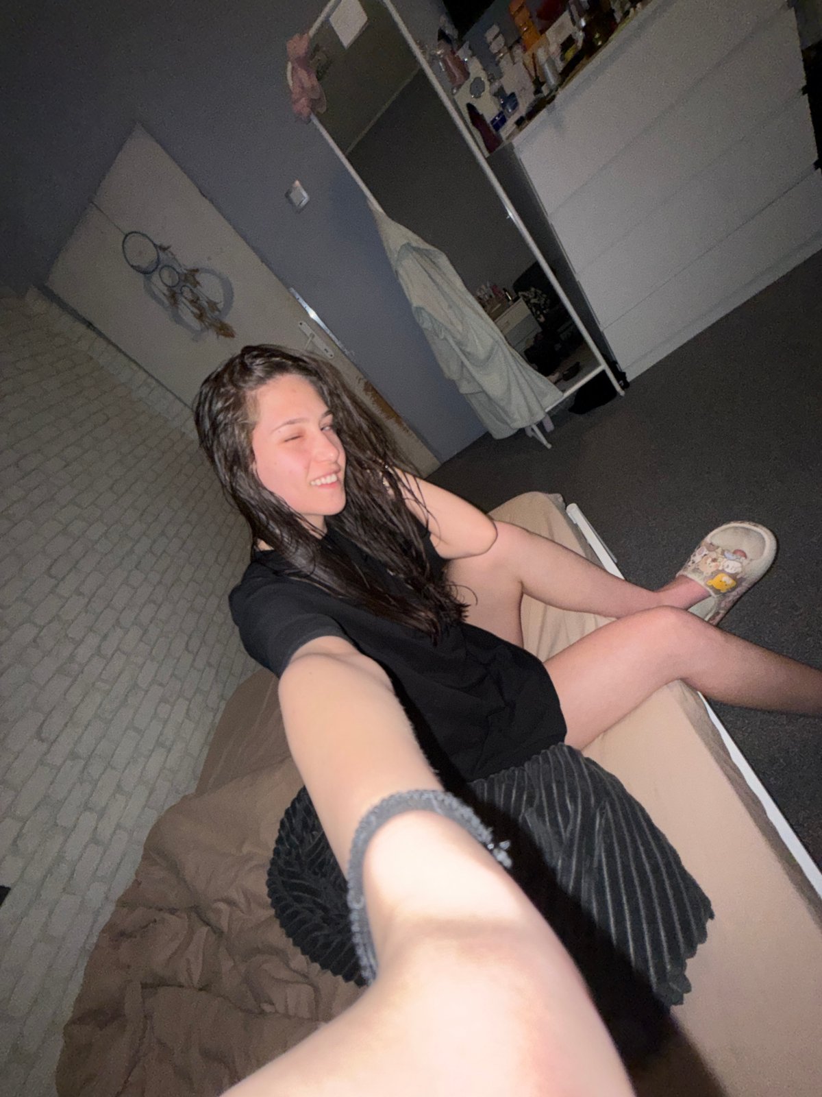 Woman resting on bed in Sofia apartment