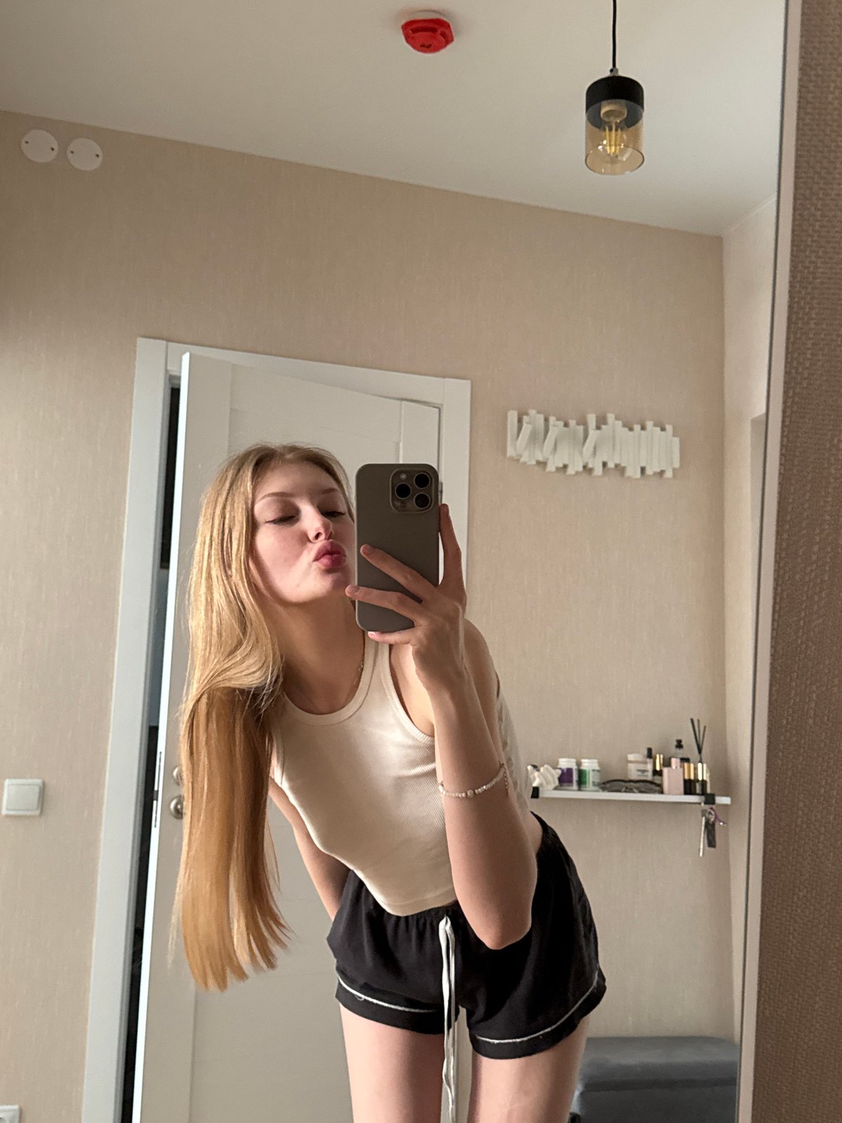 Woman takes morning selfies in Perm apartment