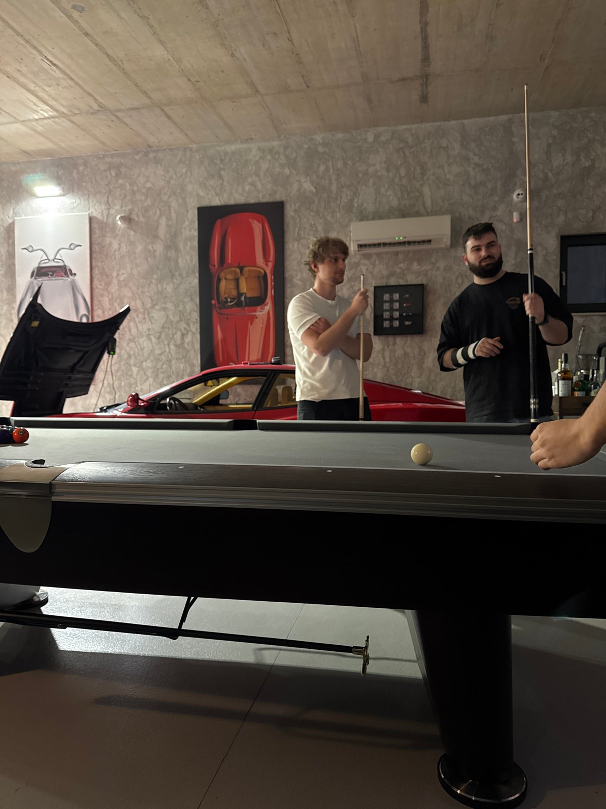 Men play billiards in Ivanyane, Bulgaria