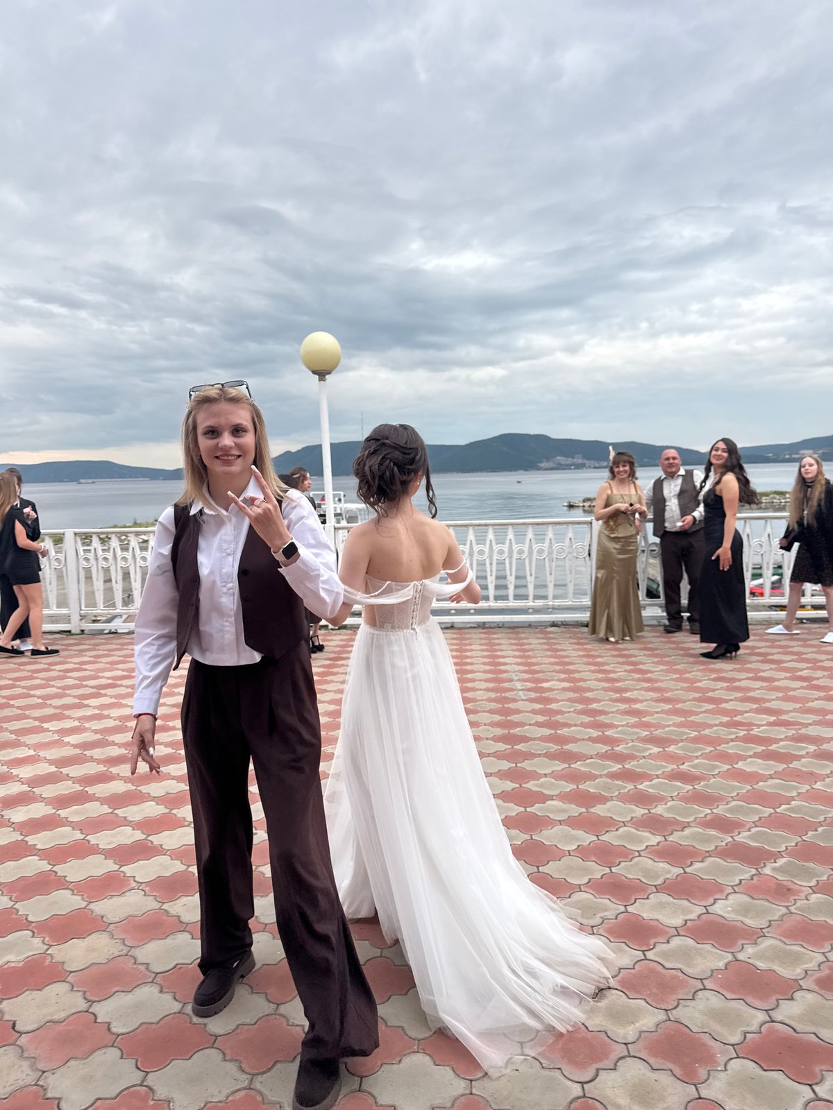 Wedding celebration held at waterfront venue with outdoor ceremony, indoor reception