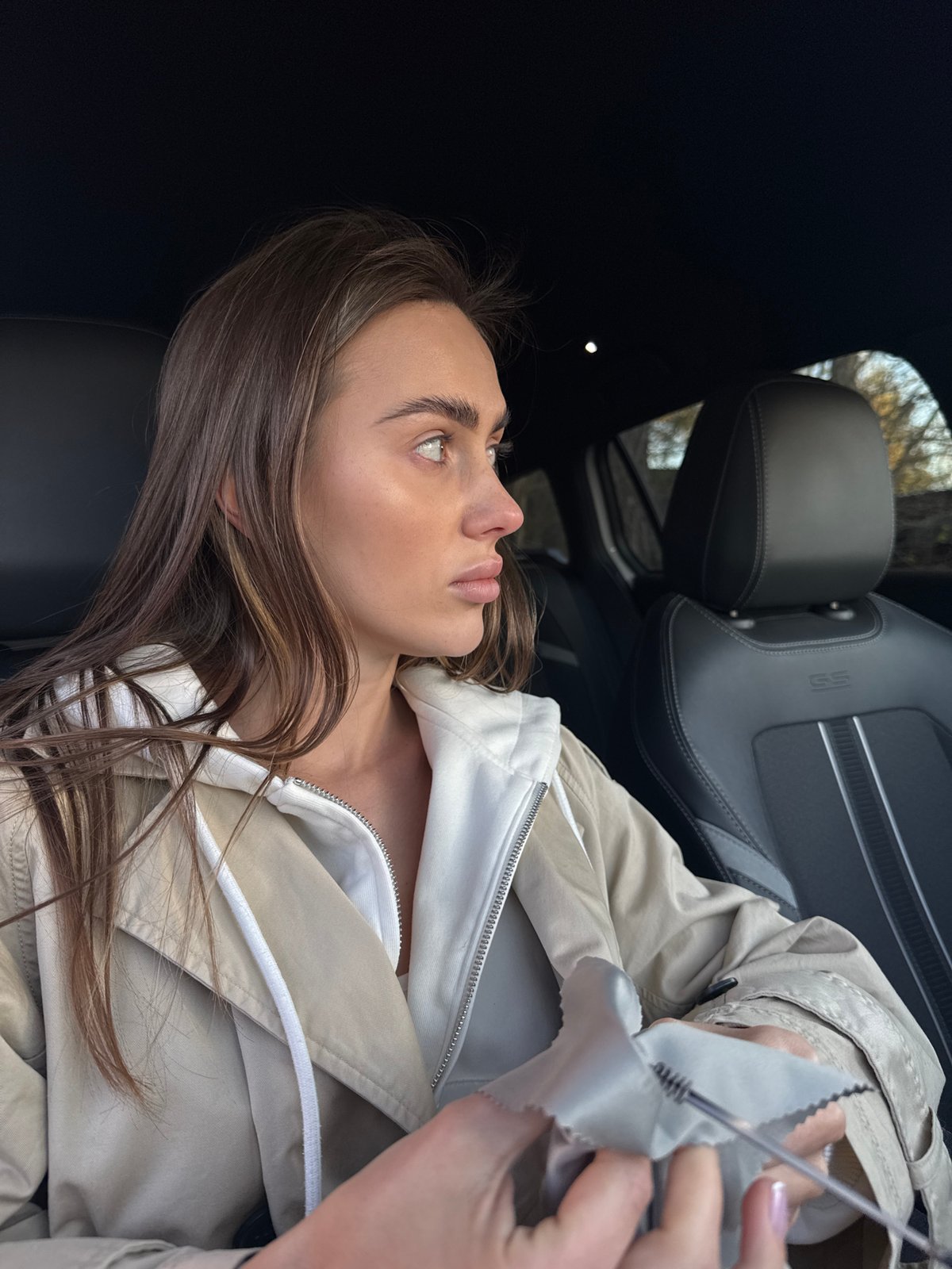 Woman photographed at harbor and in car in Białobrzegi