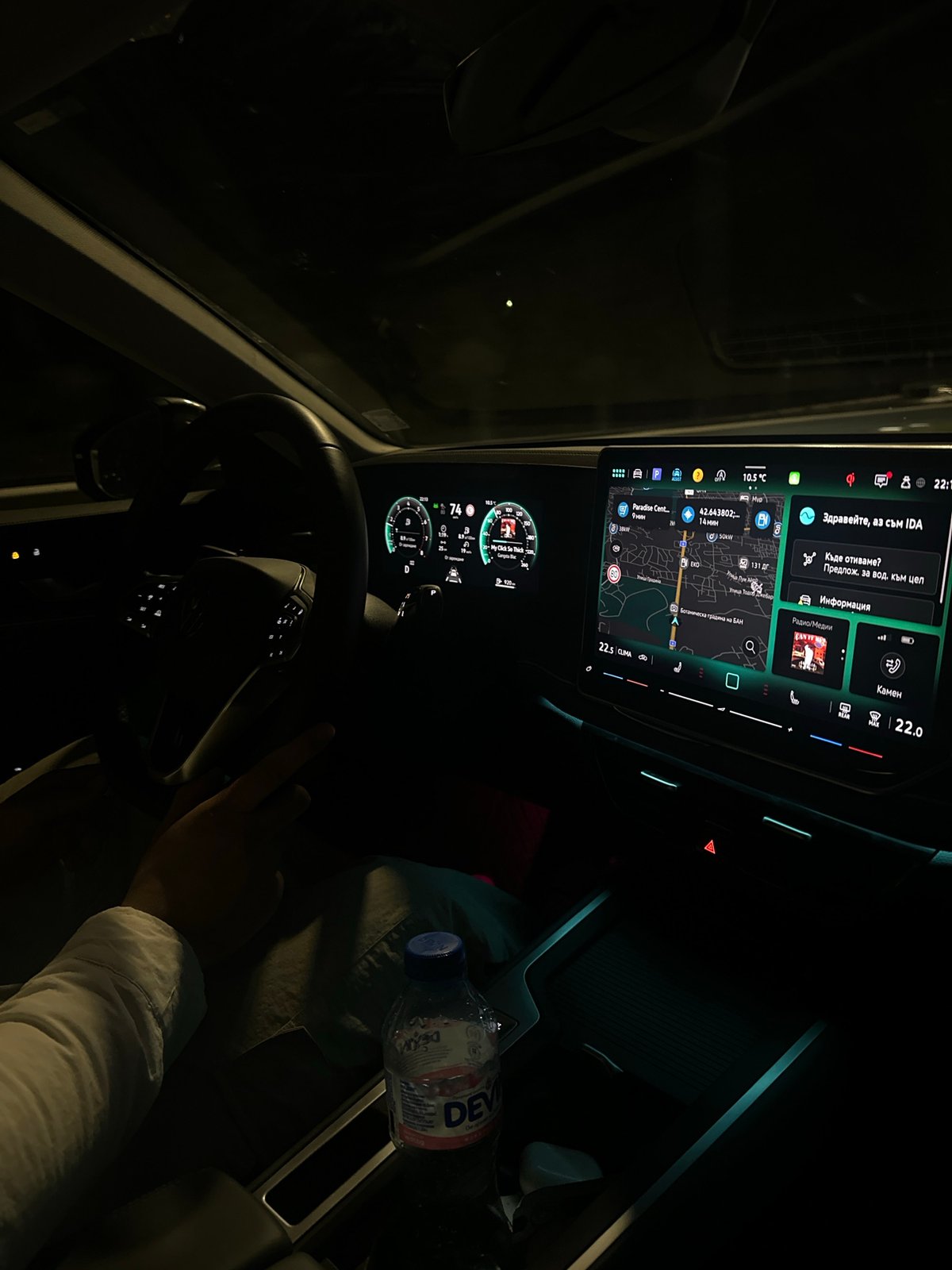 Driver navigates Sofia streets at night with dashboard display