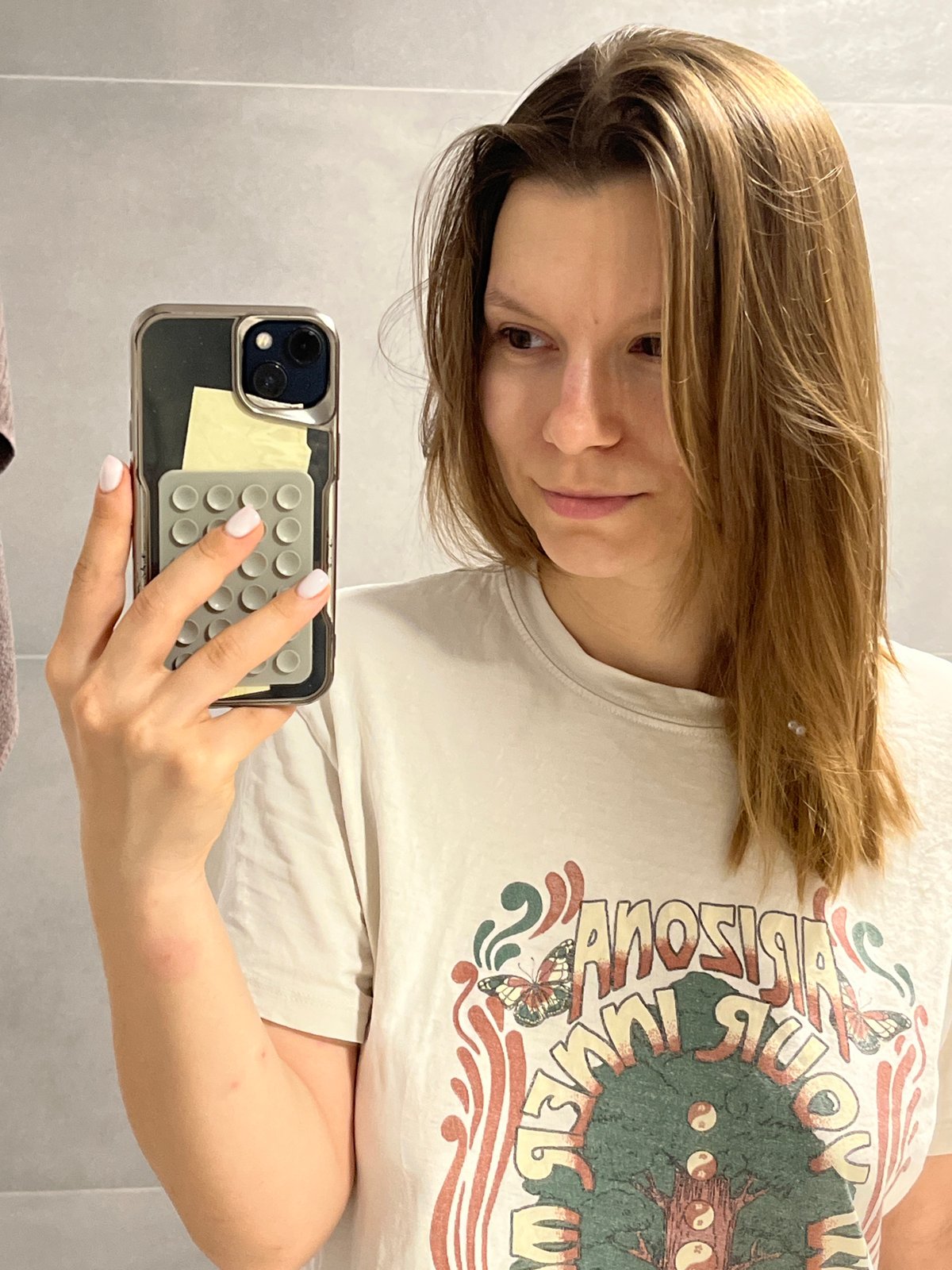 Woman documents evening skincare routine in Limassol bathroom
