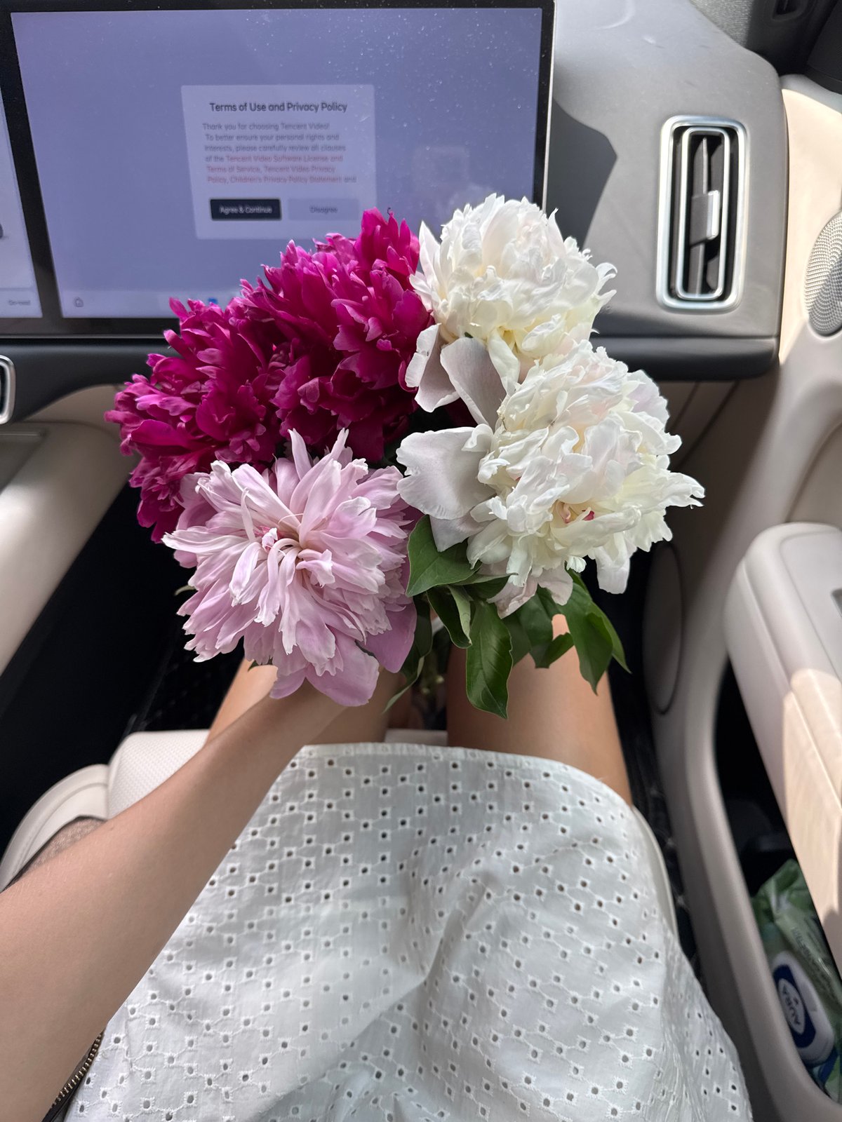 Woman with peony bouquet photographed across multiple locations