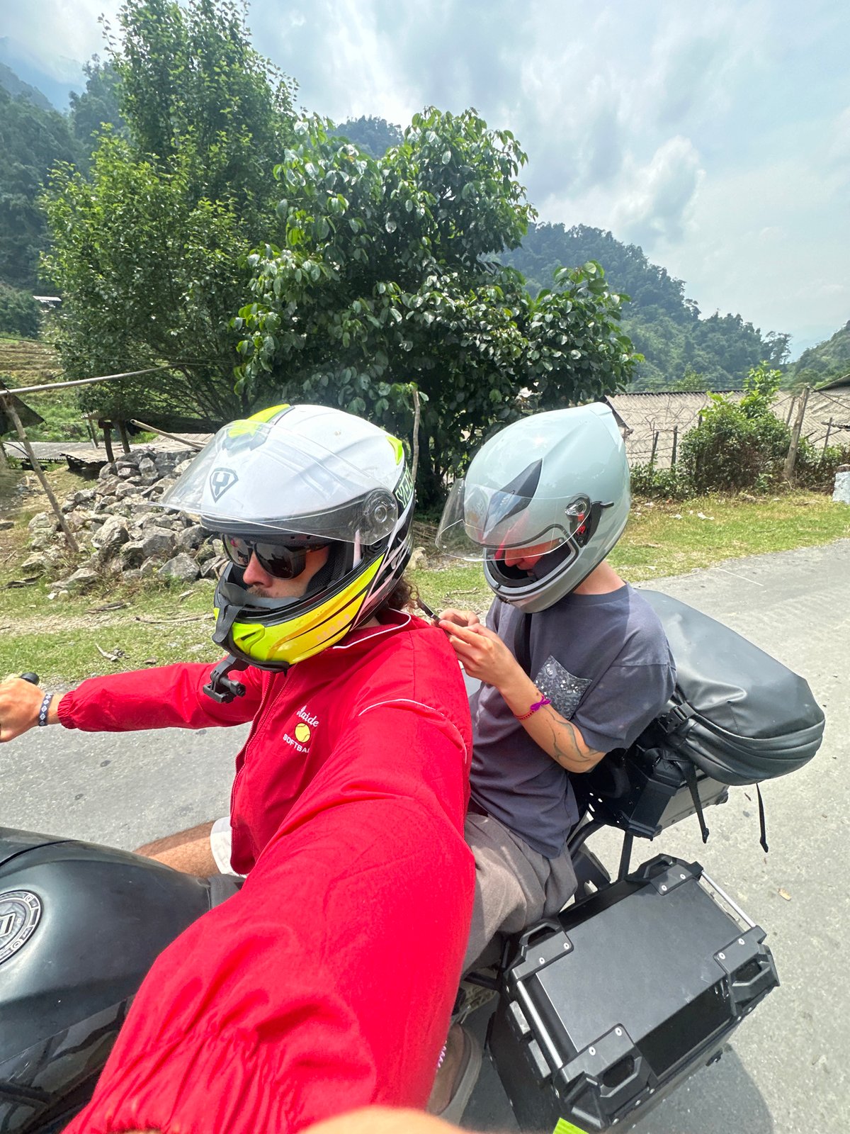 Morning motorcycle journey documented on rural Vietnamese mountain road