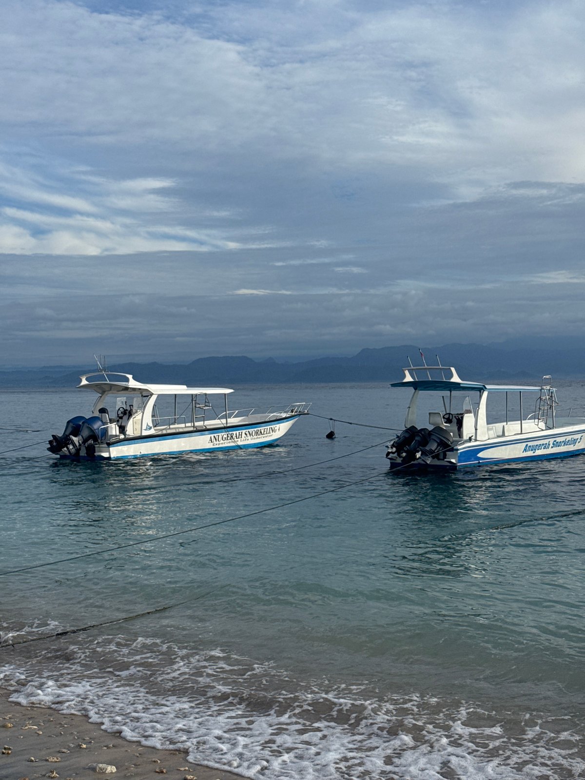 Beach boats and bar promotions captured in Nusa Penida