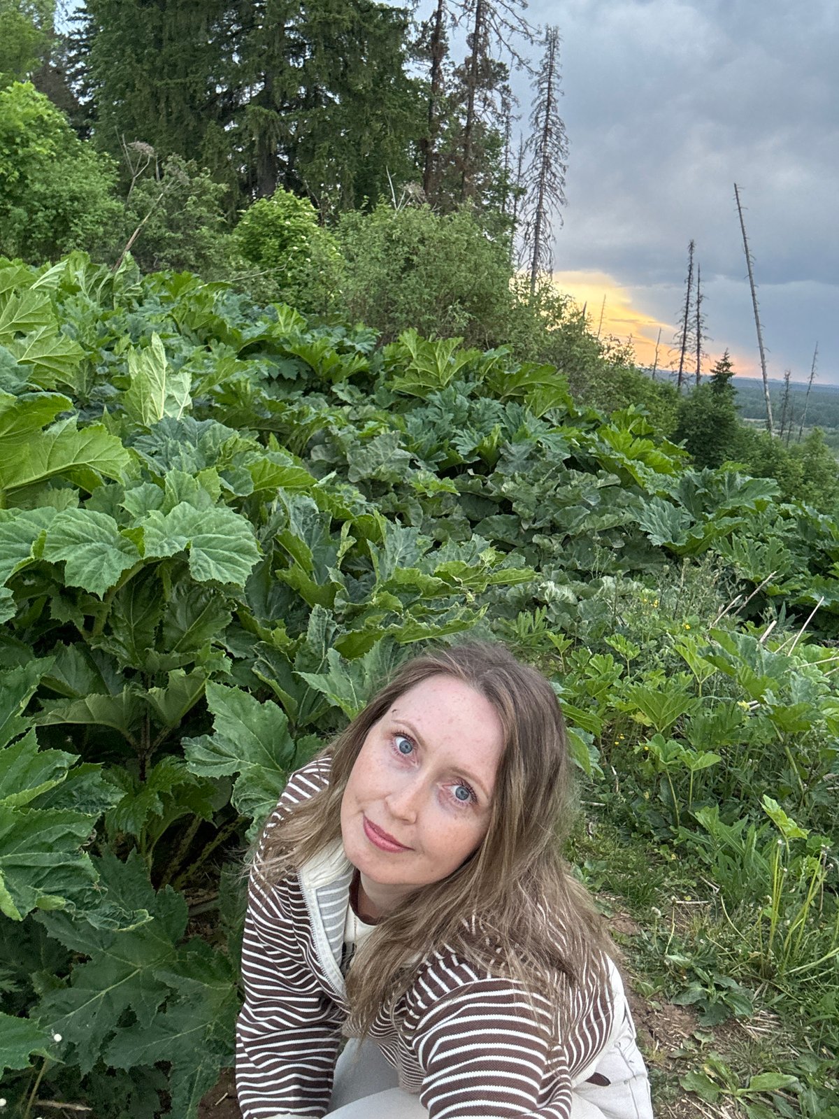 Woman photographs self and landscapes in Chaykovsky, Russia