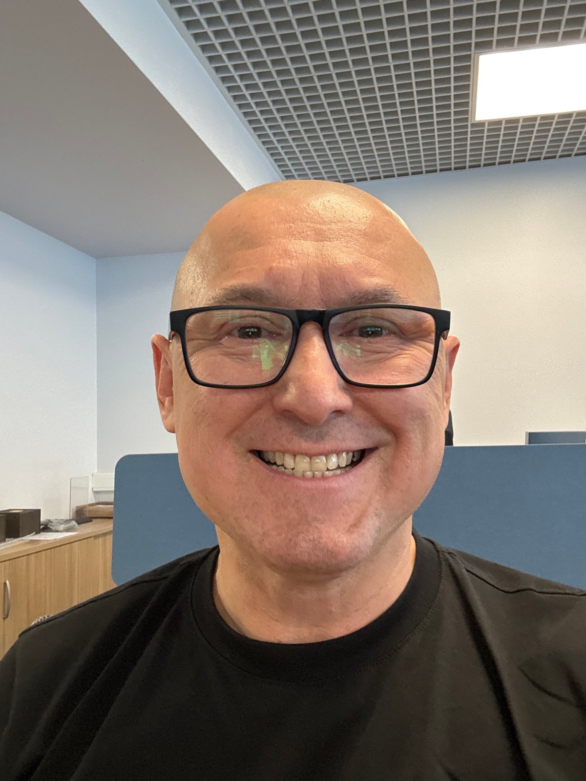 Smiling face in a Moscow office, mid-2026