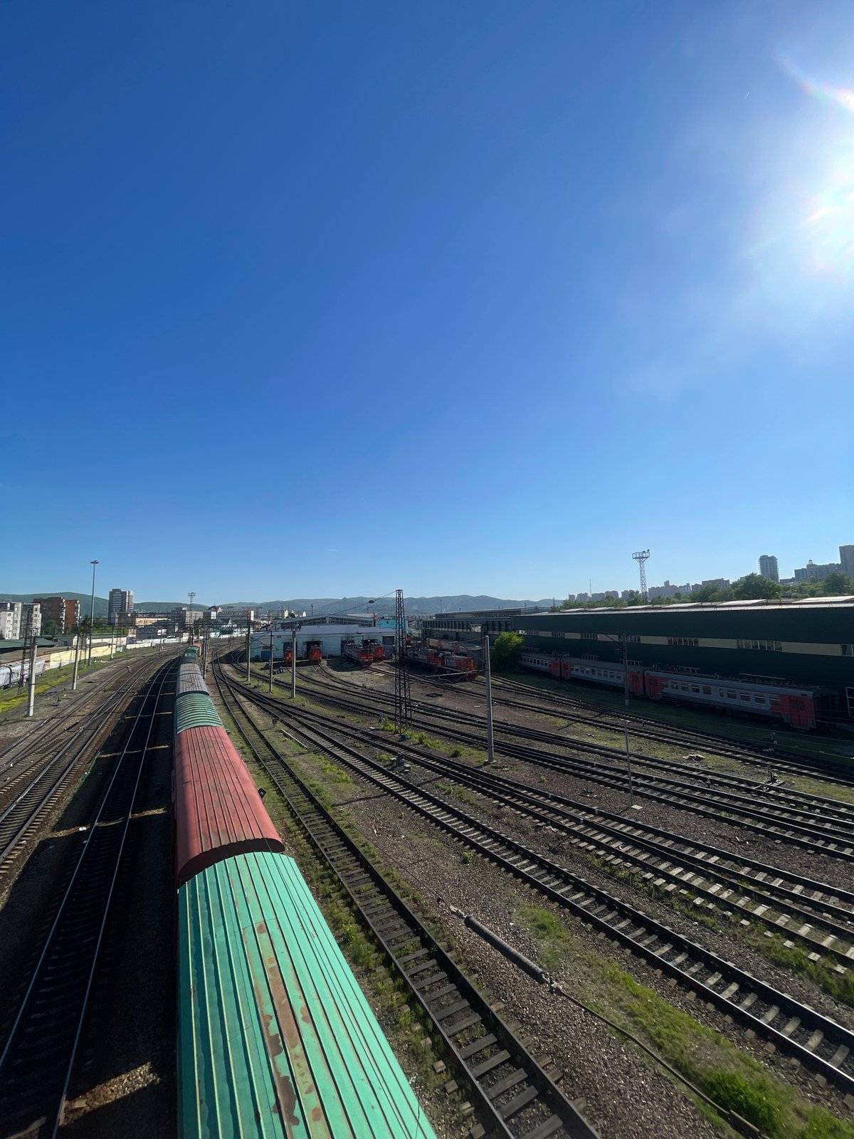 Railway yard documented in Krasnoyarsk under clear skies