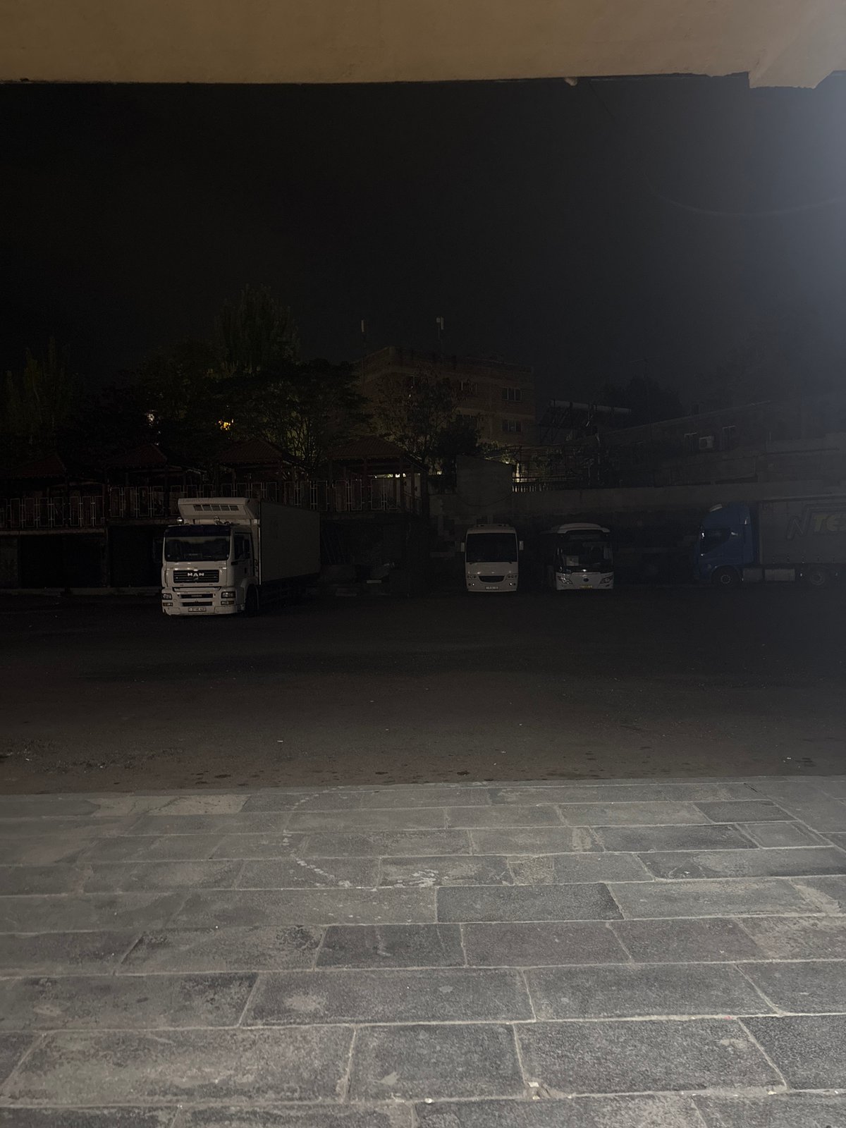 Parked MAN trucks observed on Yerevan street at night