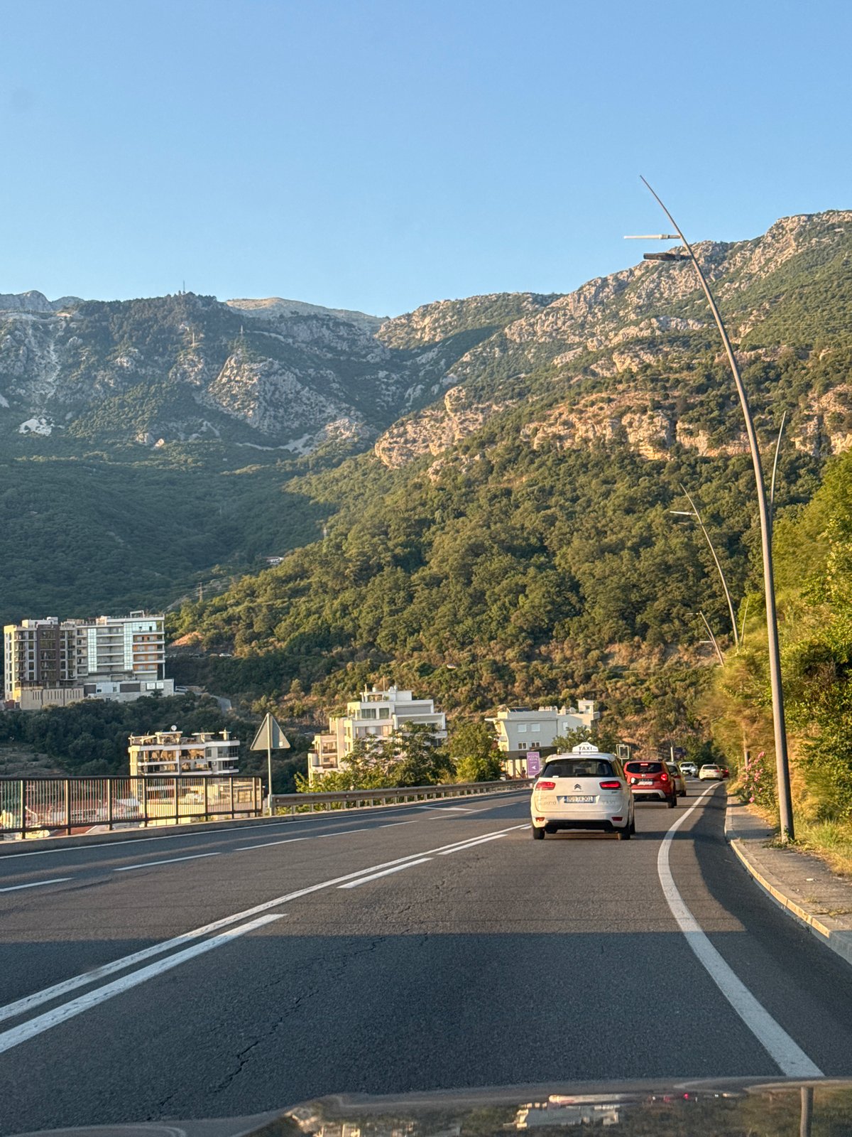 Afternoon traffic on a marked road in Rafailovići, Montenegro