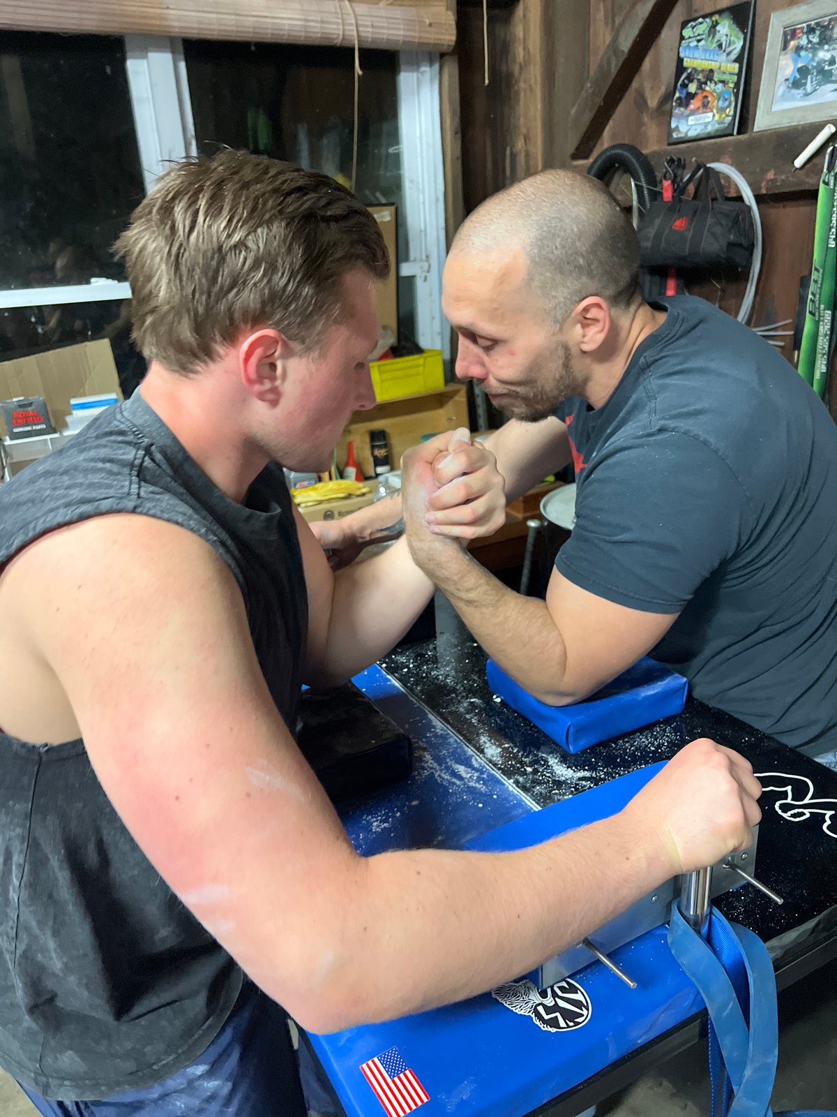 Late-night arm wrestling match captured in Orange Lake garage