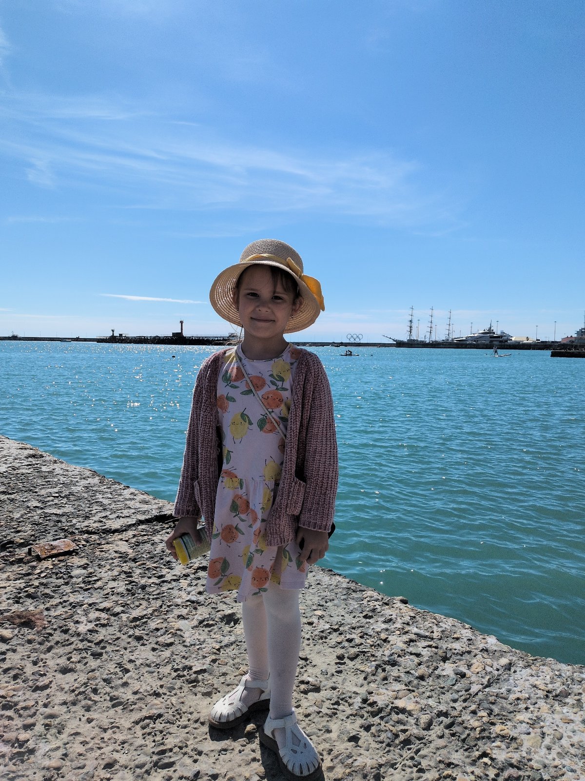 Young girl explores Sochi seaside attractions during afternoon outing