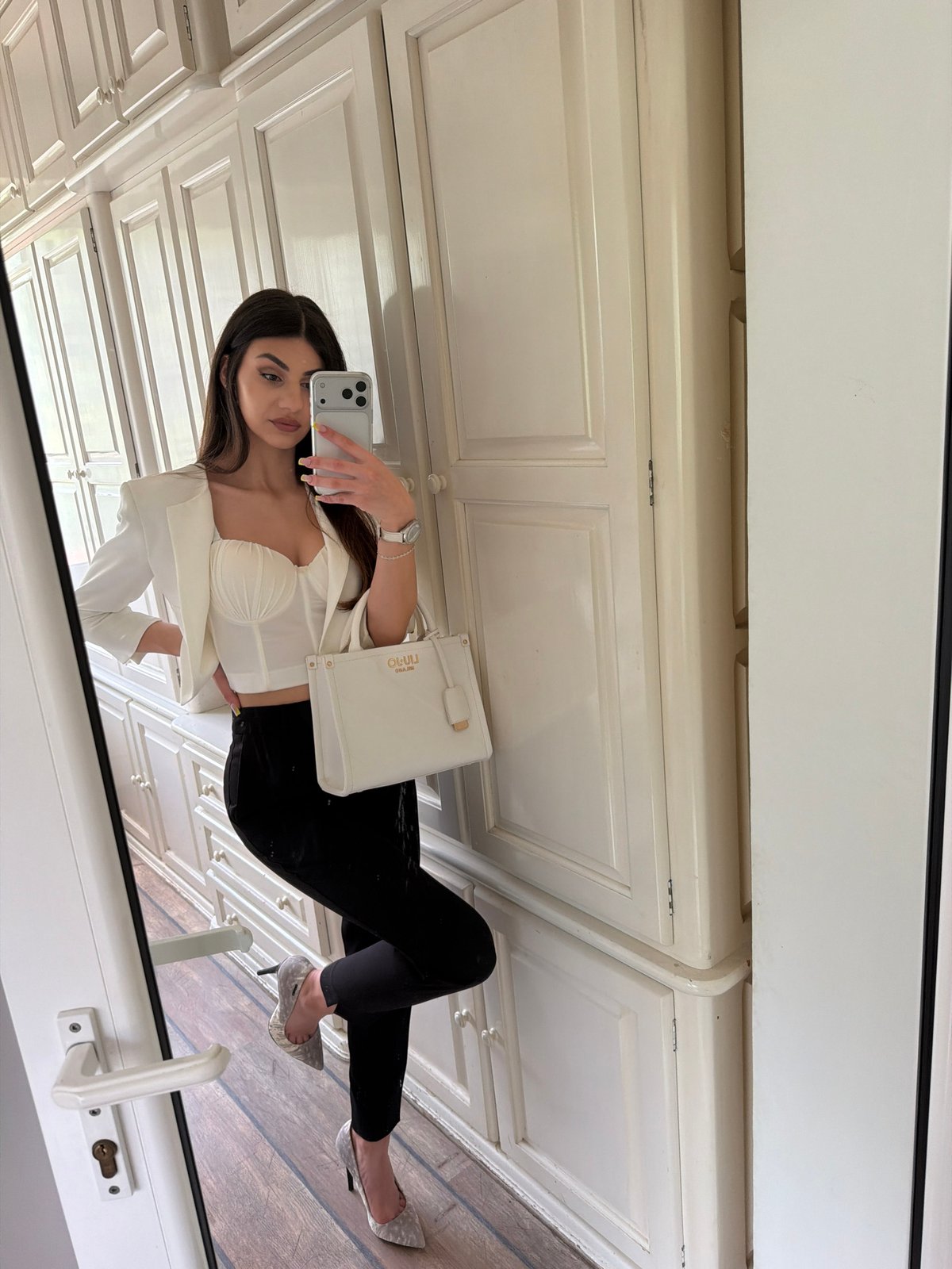 Woman takes mirror selfies in Gabrovo room