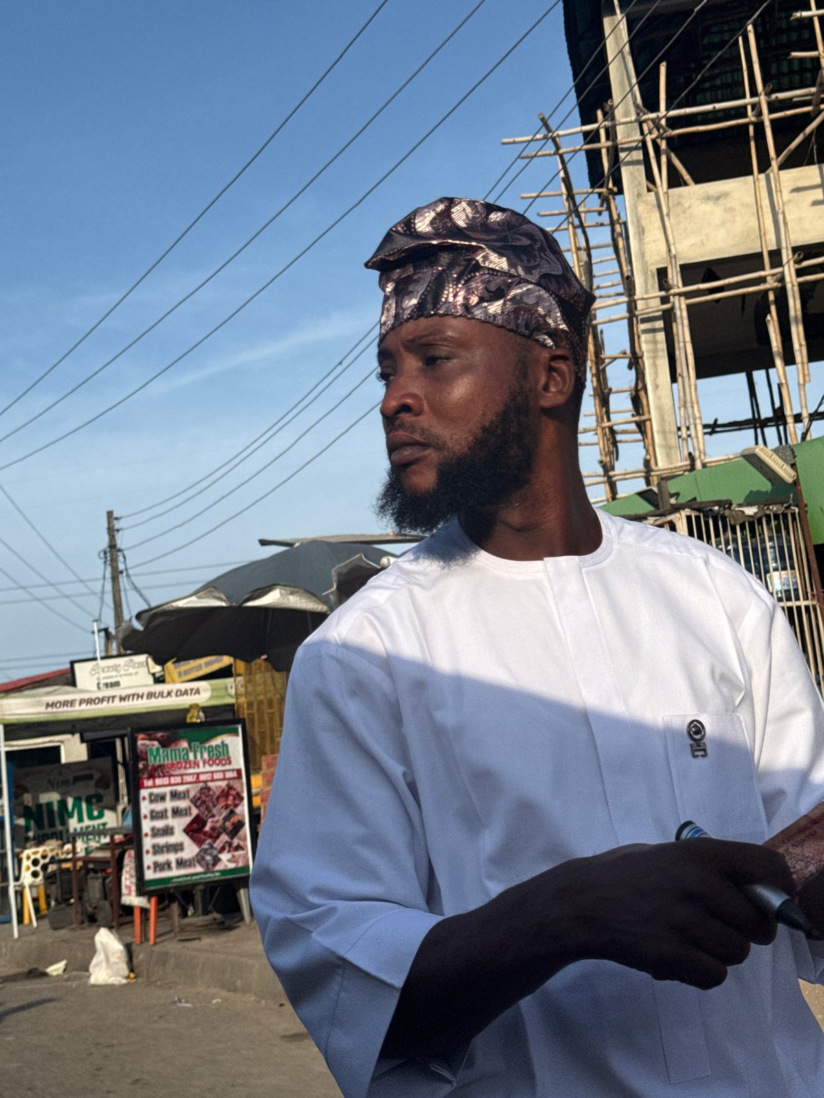 Street scene documented in Ado, Nigeria amid commercial activity