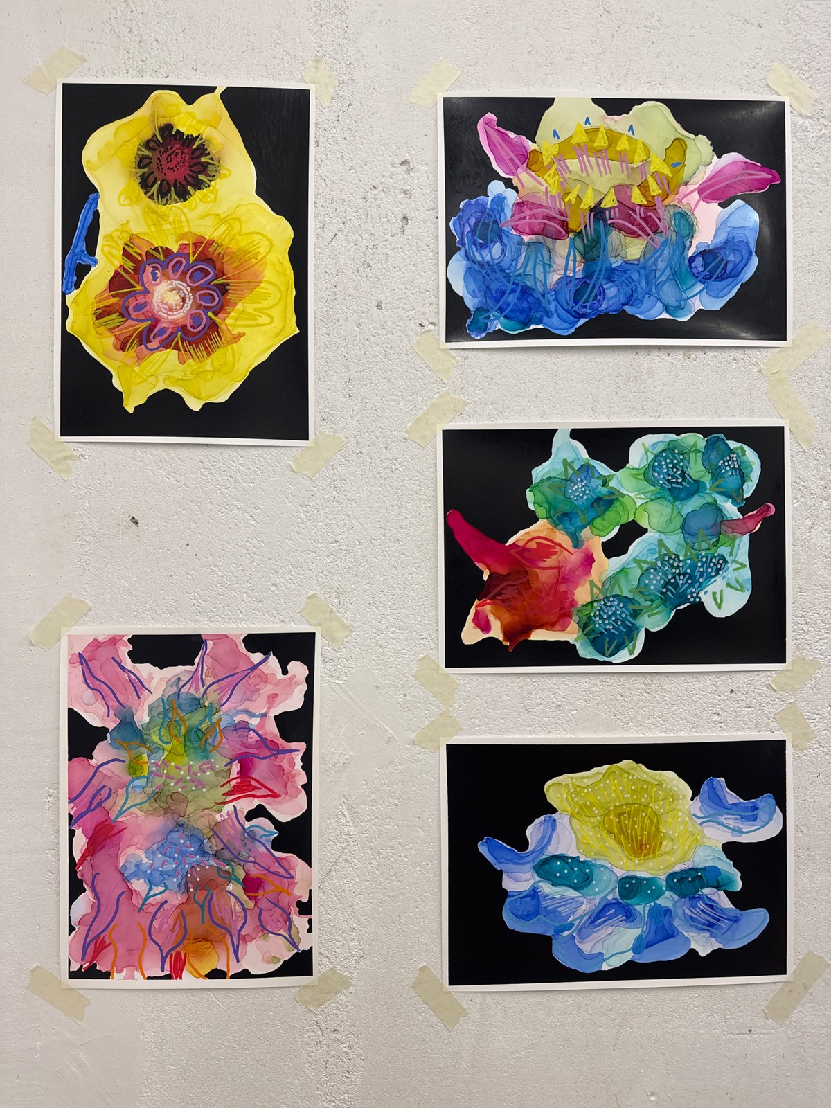 Floral paintings displayed on white wall in Moscow