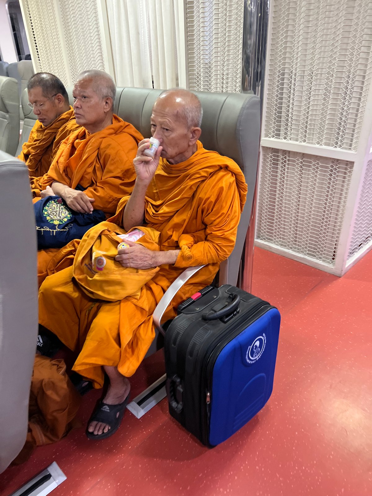 Monks in a vehicle and bold footwear, Nathon streets
