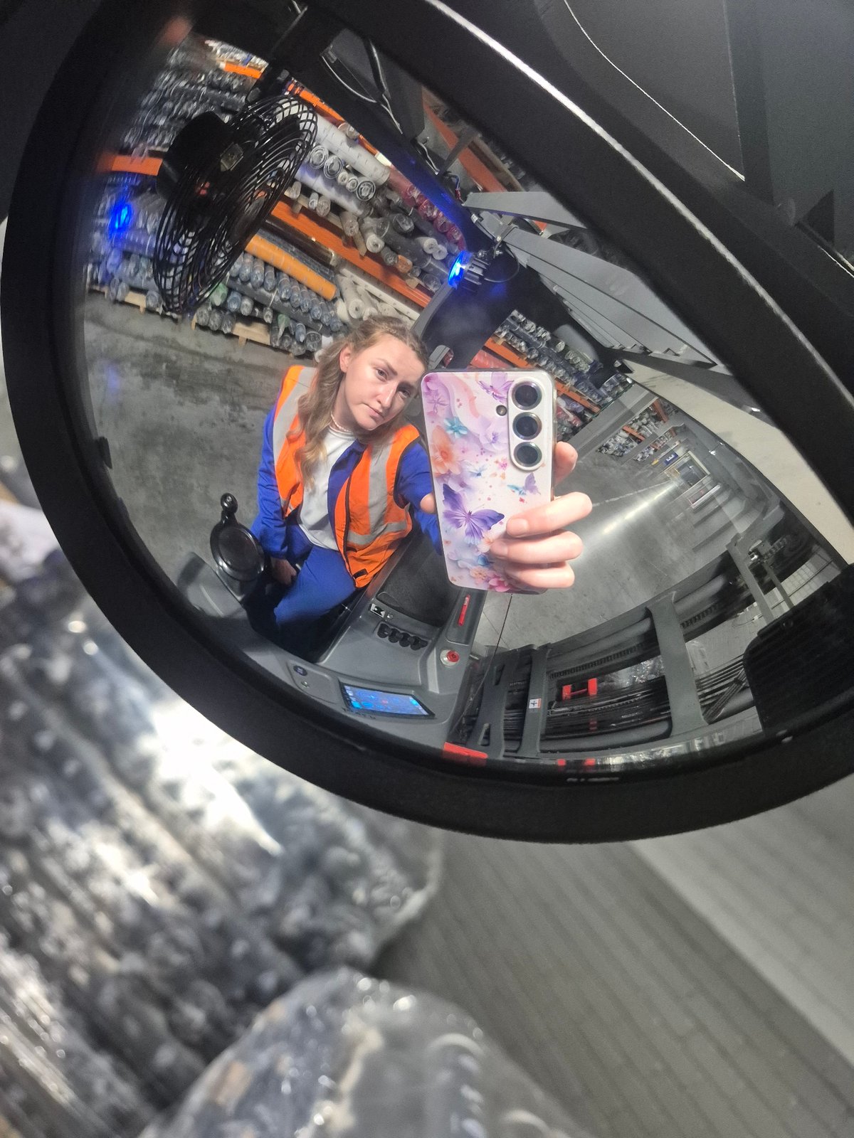 Forklift mirror selfie from a warehouse in Chaikovsky, Russia