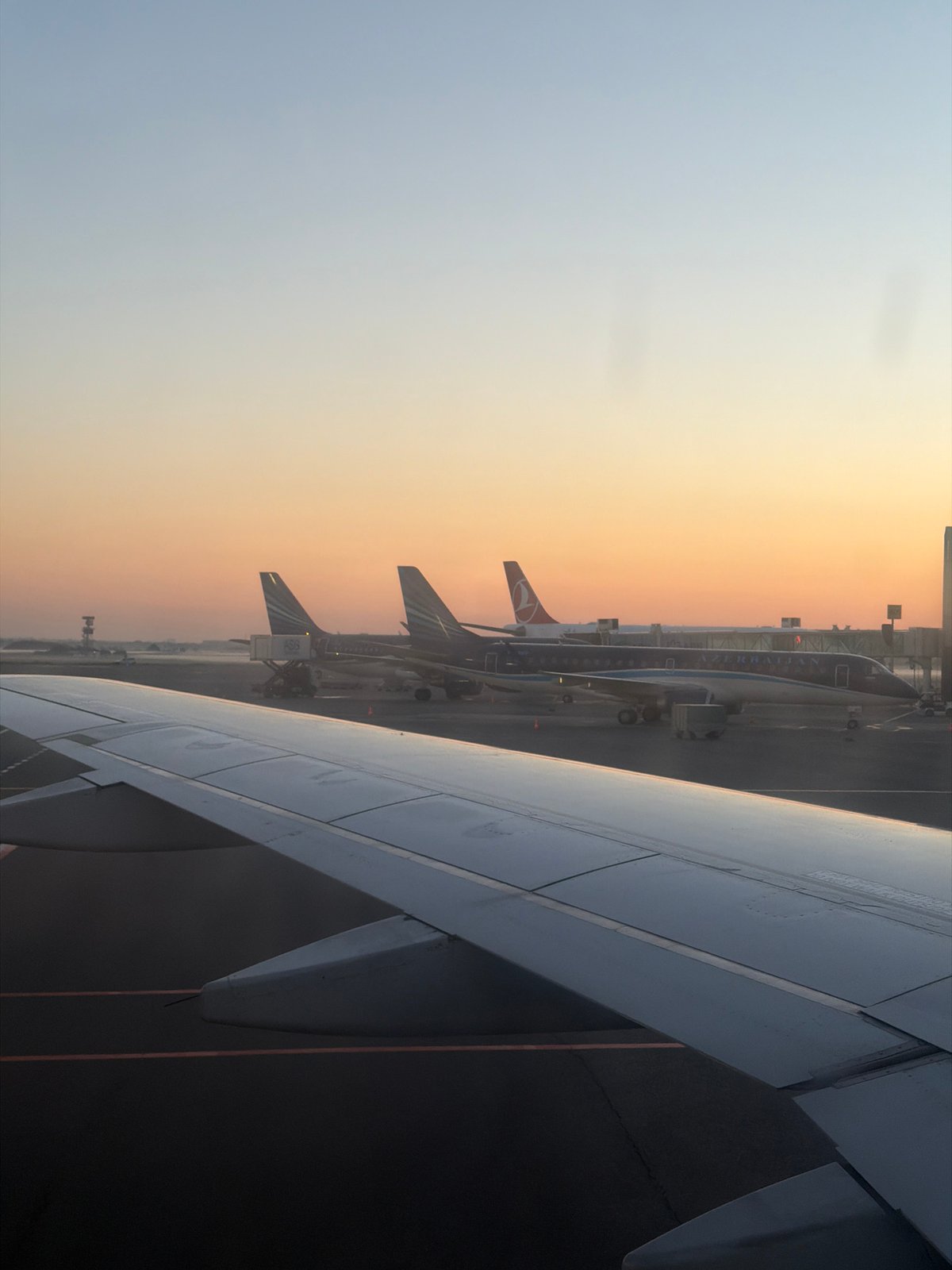 Dawn activity at Baku's Heydar Aliyev Airport, Azerbaijan Airlines on the tarmac