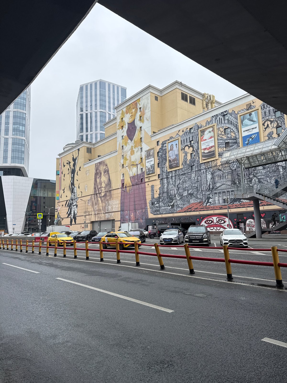 Space-themed mural with astronaut figures documented in Moscow