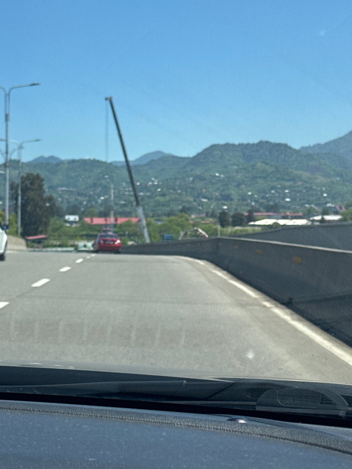 Driver documents curved elevated road in Batumi, Georgia