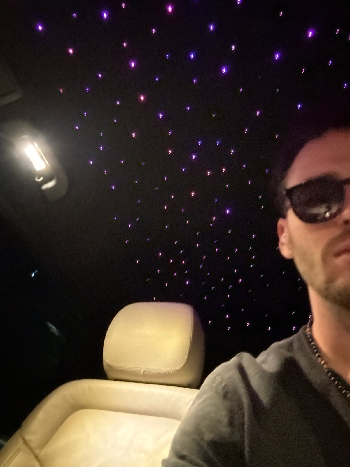 Person spotted in illuminated vehicle interior in Milan