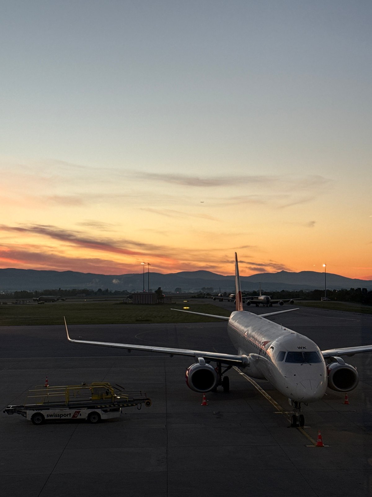 Aircraft parked at Sofia Airport during dusk operations