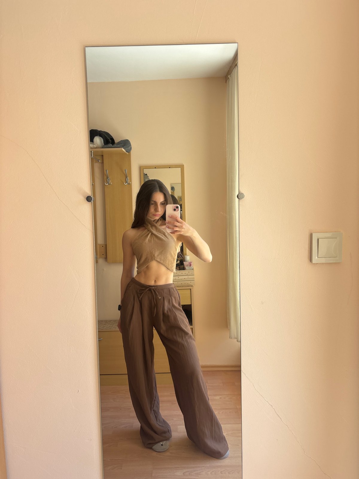 Woman documents outfit in mirror selfie session in Varna