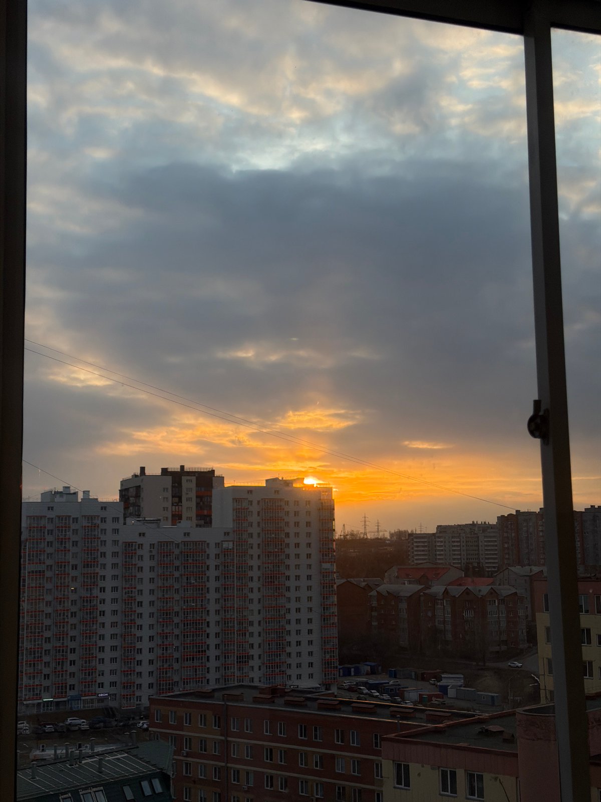 Sunset observed over Krasnoyarsk apartment buildings April 15