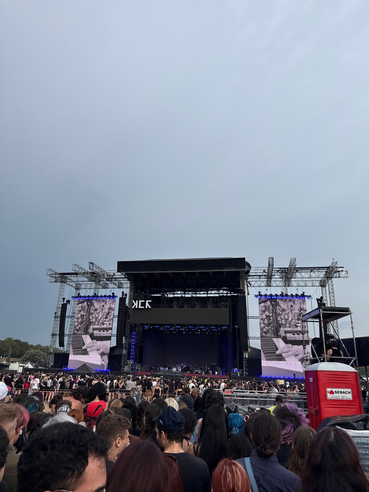 Outdoor concert with 'KCK' on stage in Florence