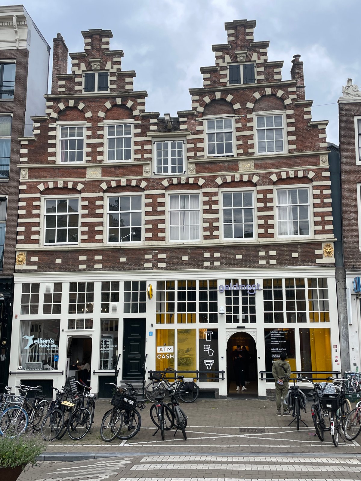 Amsterdam street scenes documented showing traditional architecture, local cafe