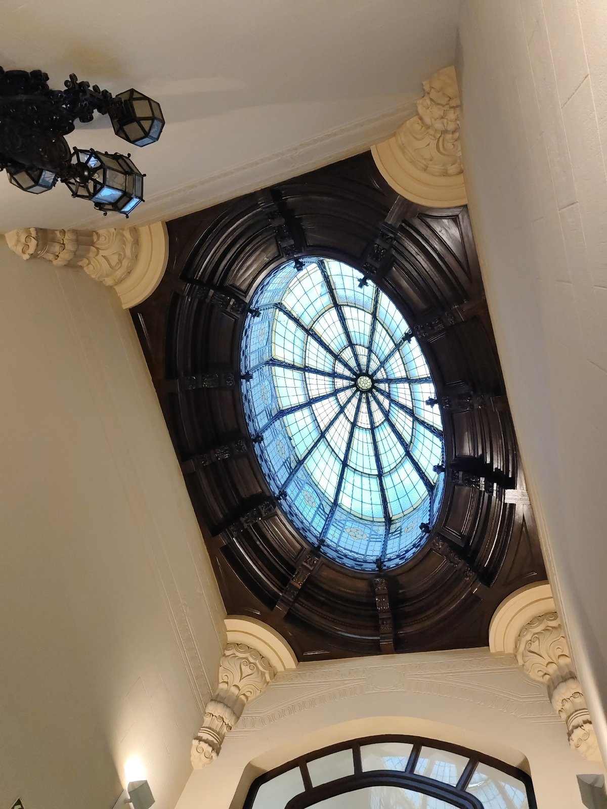 Ornate stained glass ceiling feature documented in Barcelona