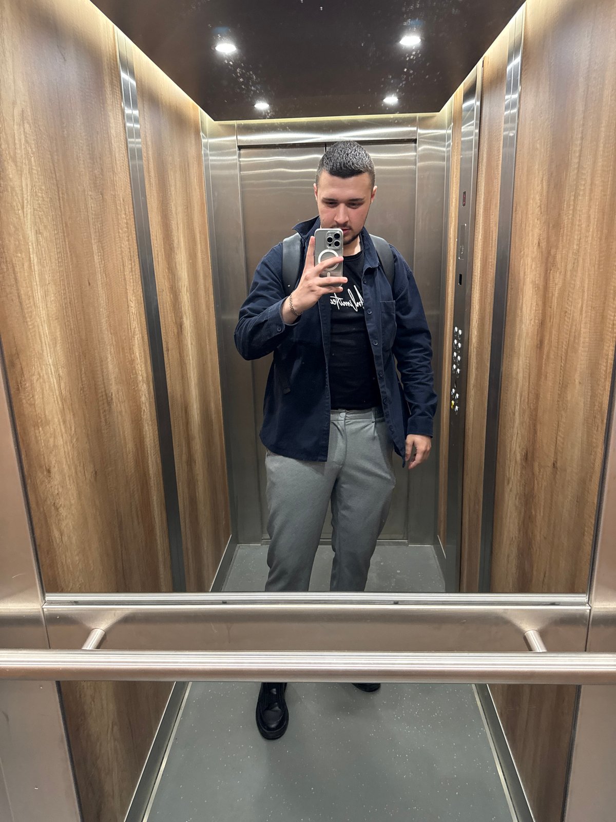 Sofia resident documents morning routine with elevator selfie, coffee break