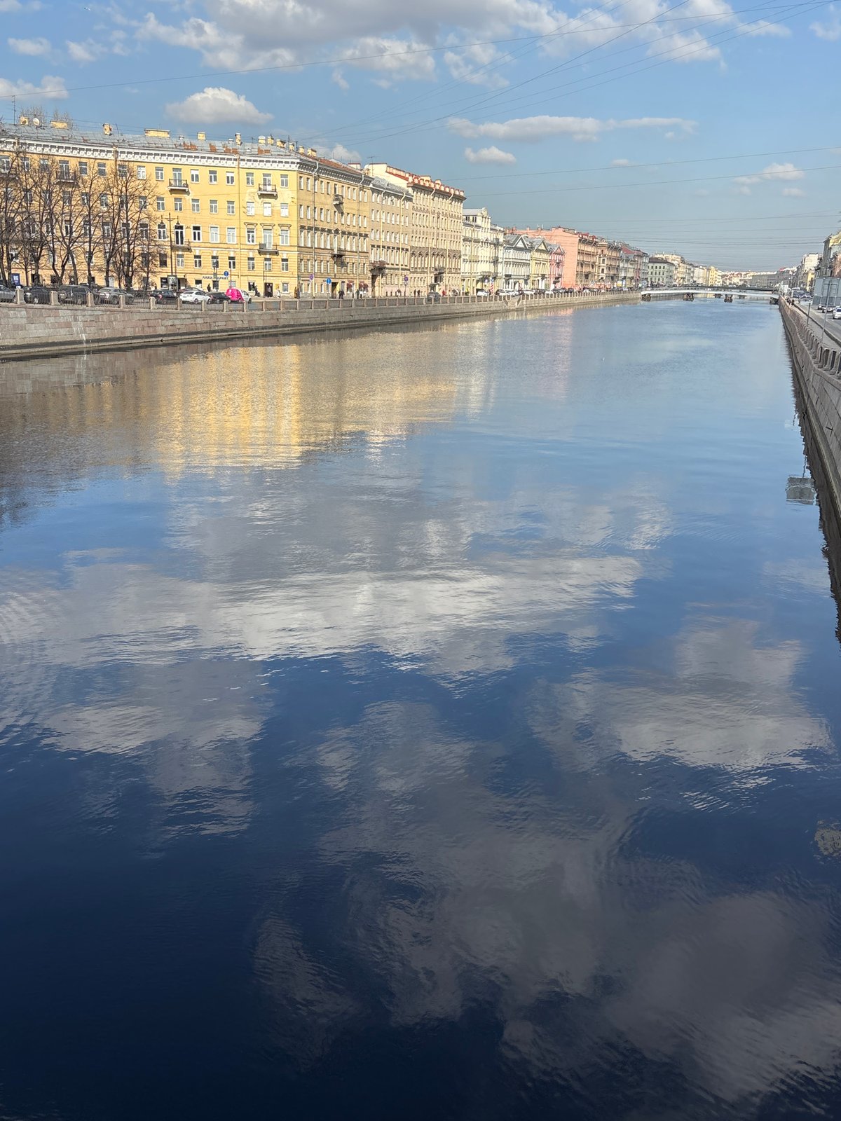 Tourist captures selfie, street scenes along Saint Petersburg canals