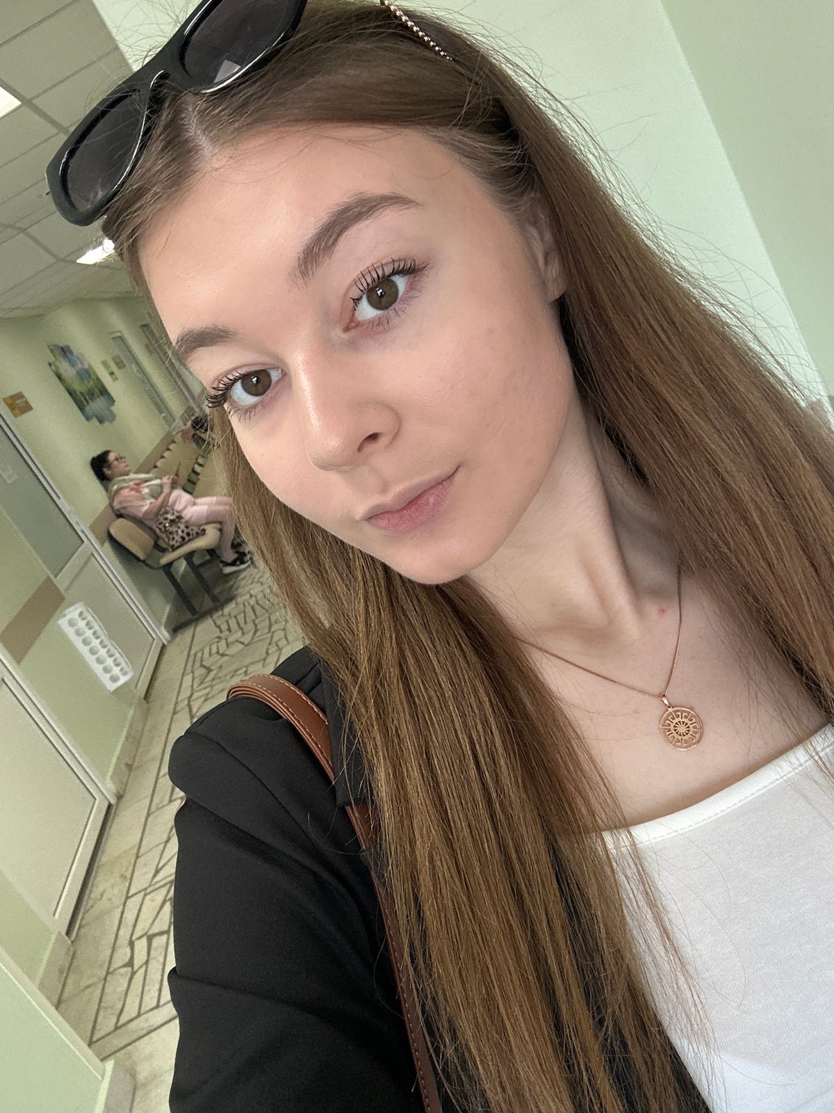 Woman takes selfies in Kazan medical office waiting area