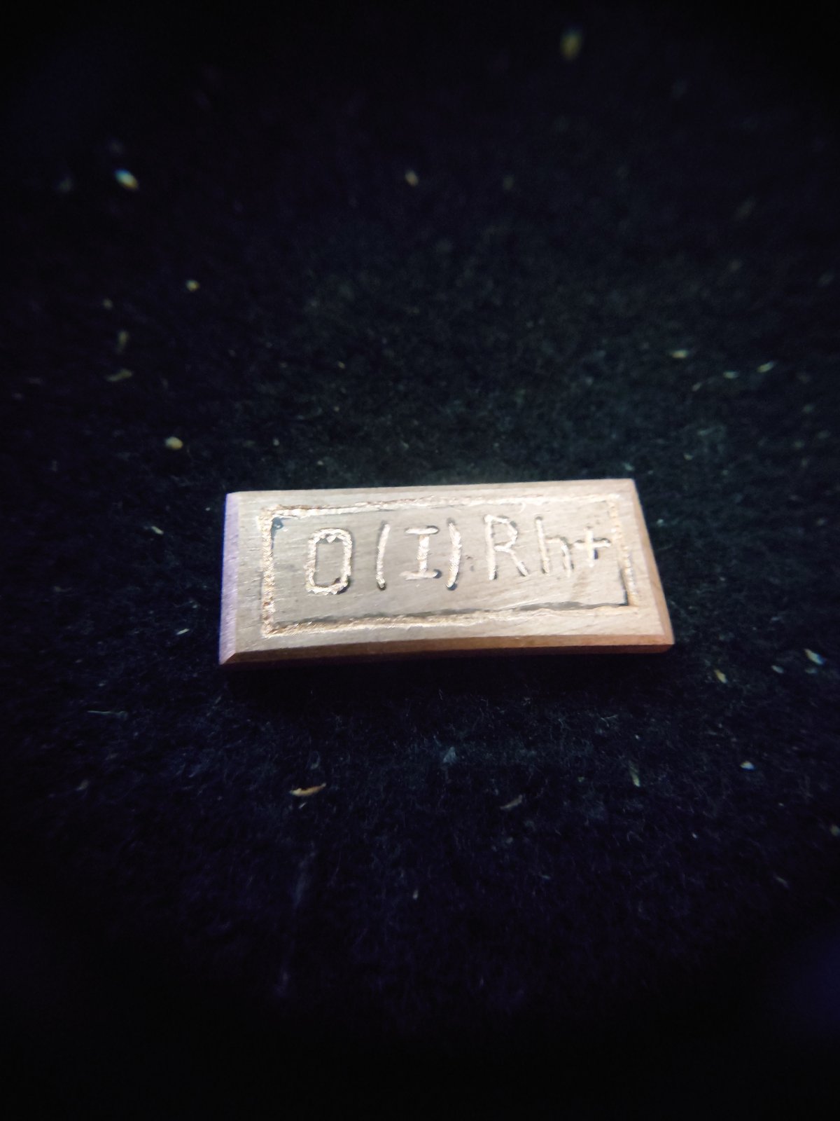 Close-up detail shots of engraved metal objects and backlit keyboards