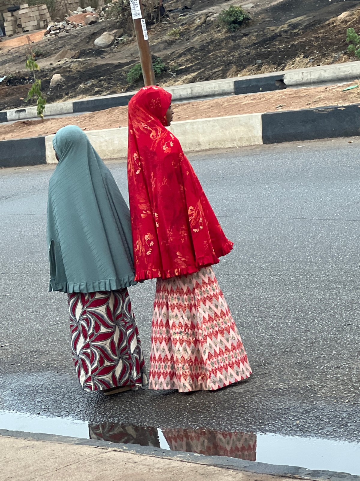 Daily life scenes documented across Jos, Nigeria during wet weather
