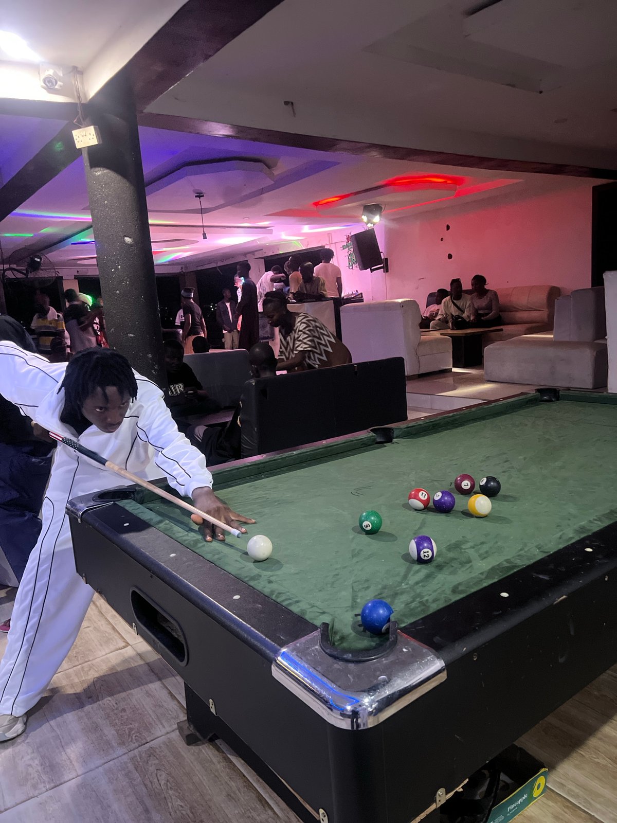 Evening social gathering with pool games at Howayi bar