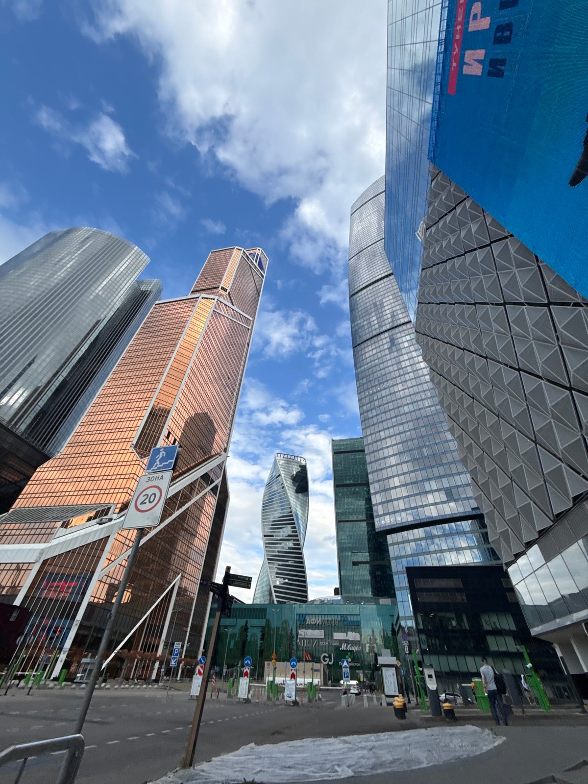 Observer documents Moscow City skyscrapers from Khimki under cloudy skies