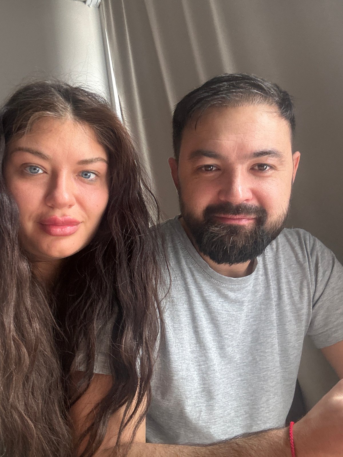 Couple photographed together indoors in Moscow